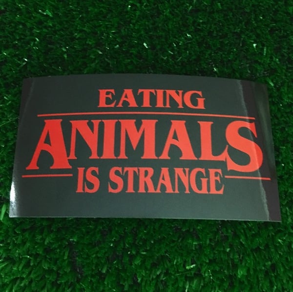 Image of Eating animals is strange vinyl sticker