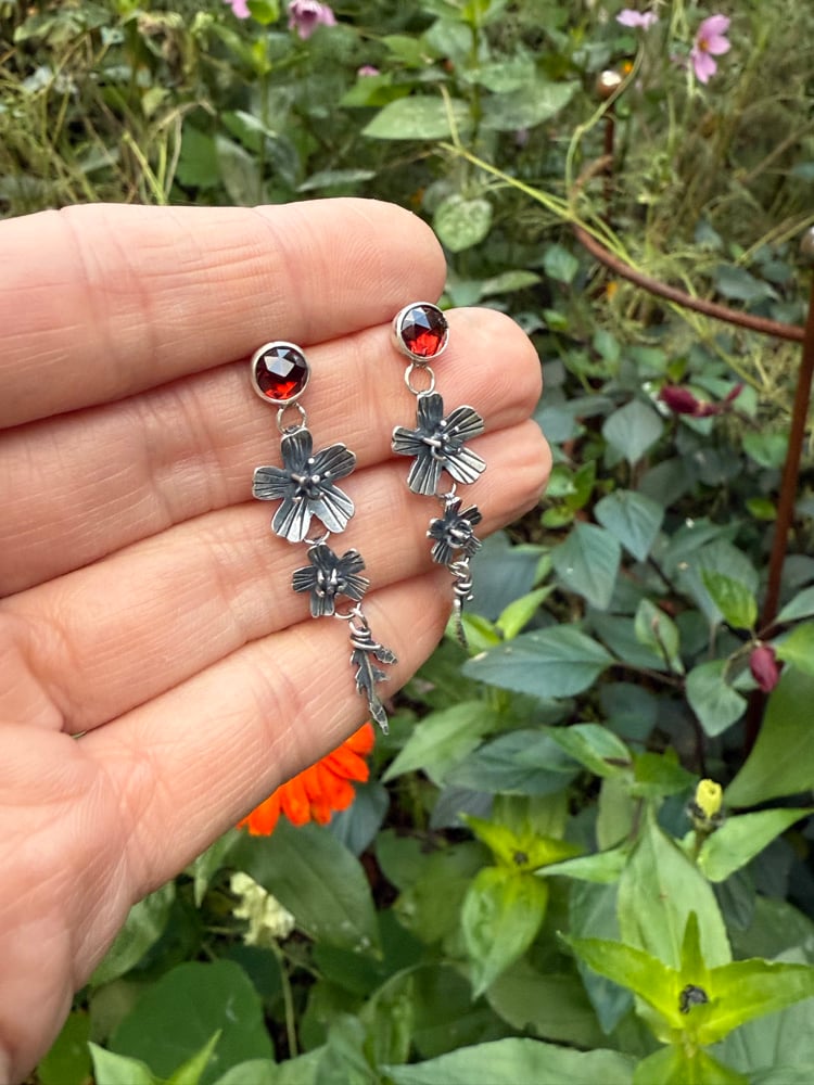 Image of Tiered Signet Marigold Flowers Leaves Garnet Stud Earrings