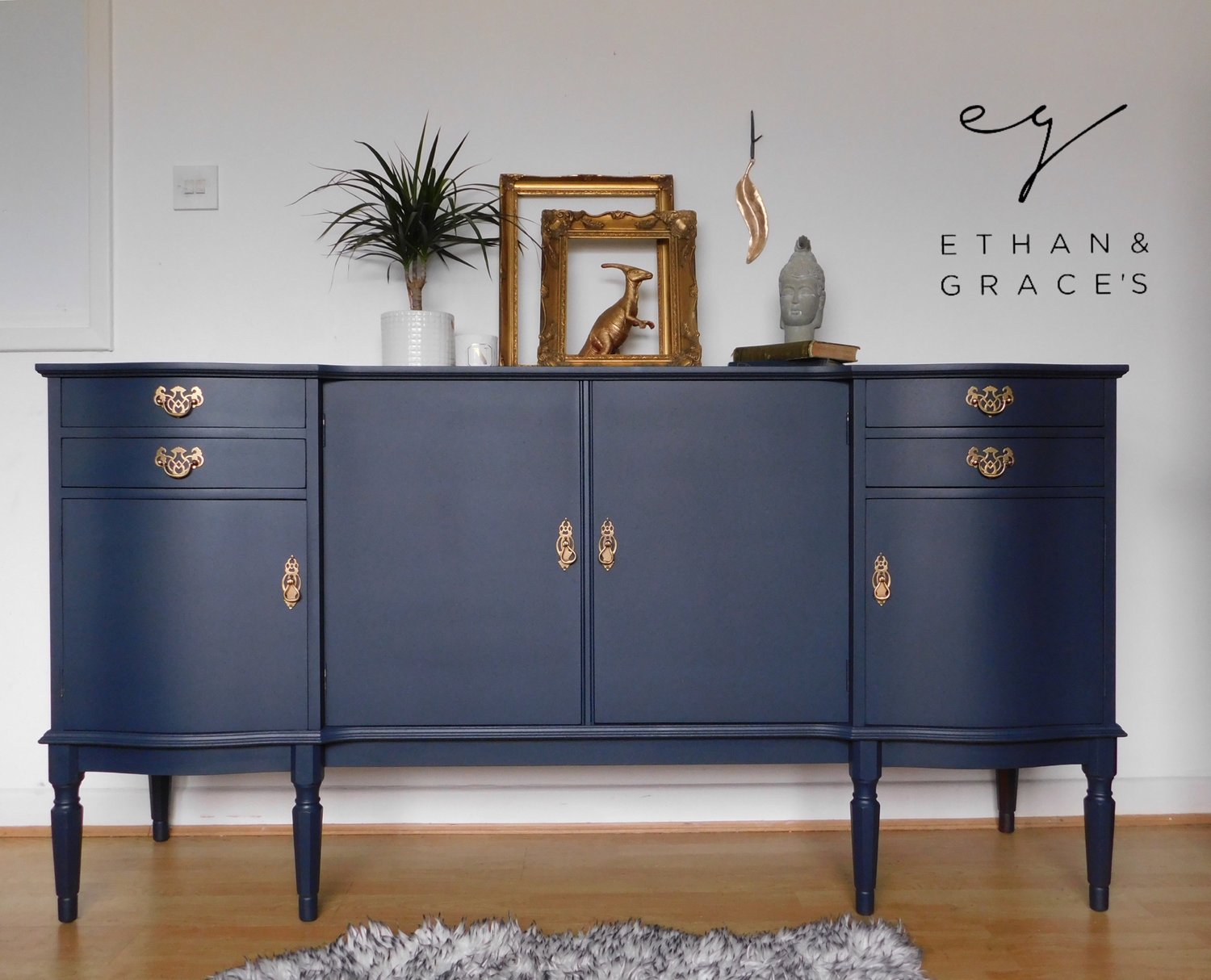 Image of A dark blue wooden sideboard