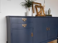 Image 3 of A dark blue wooden sideboard