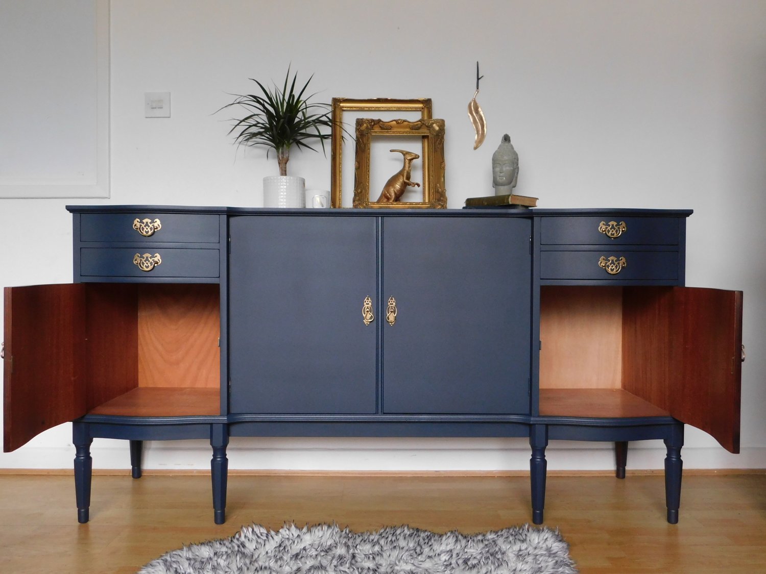 Image of A dark blue wooden sideboard