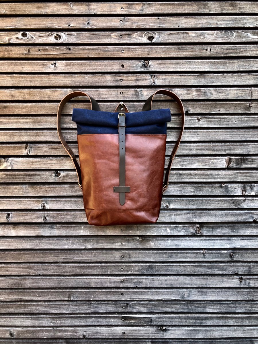 Image of Backpack in oiled leather with waxed canvas roll to close top in waxed canvas