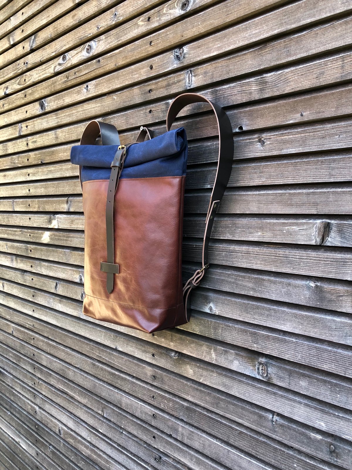Image of Backpack in oiled leather with waxed canvas roll to close top in waxed canvas