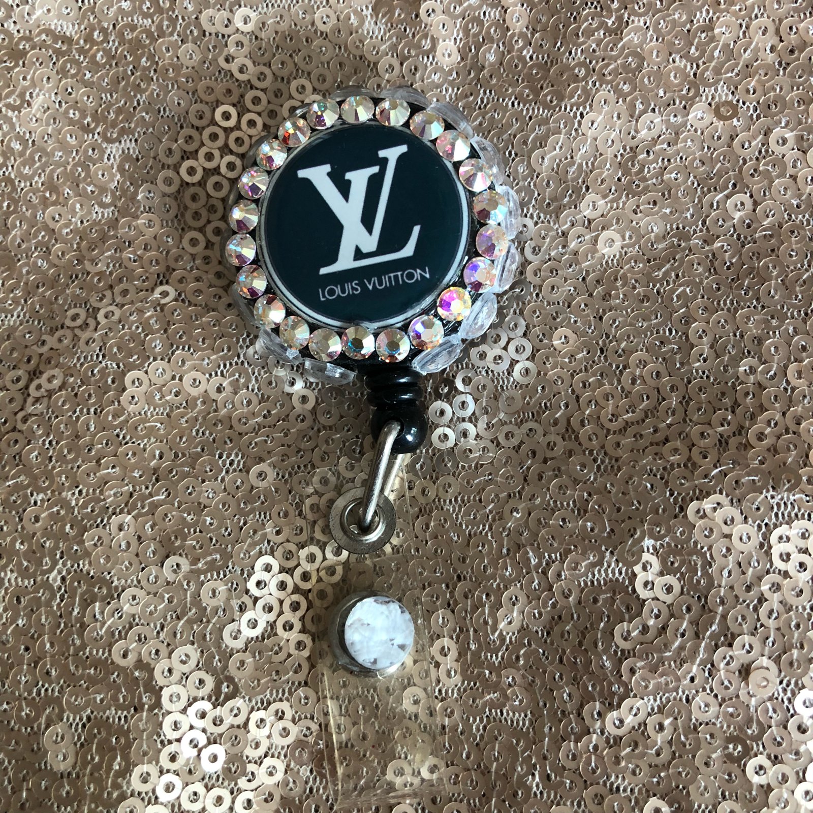 Louis vuitton discount badge reel