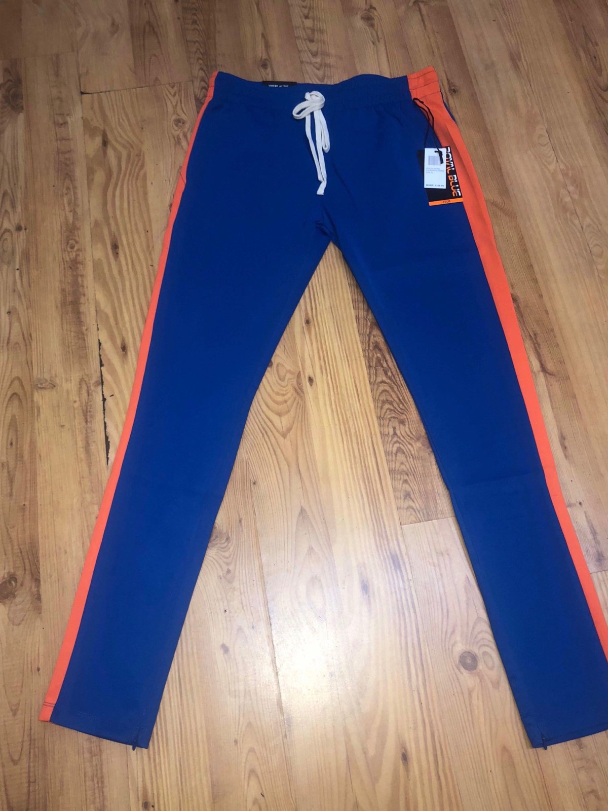 orange and blue track pants