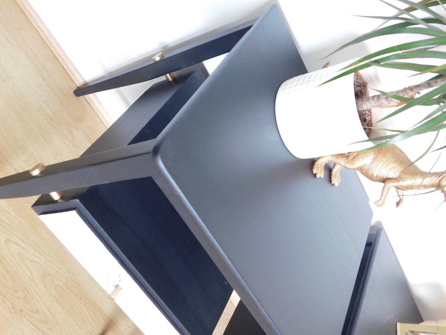 Image of A pair of black, gold and marble bedside tables