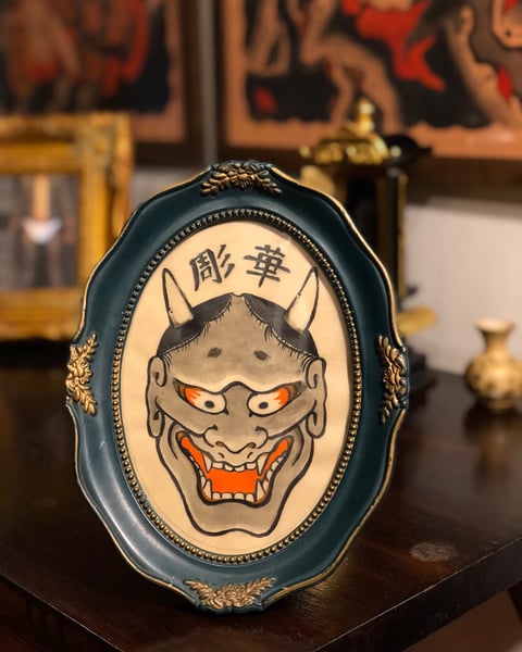 Image of Hannya with a old frame