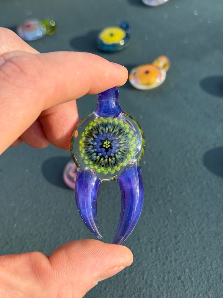 Image of  Green and purple horned pendant