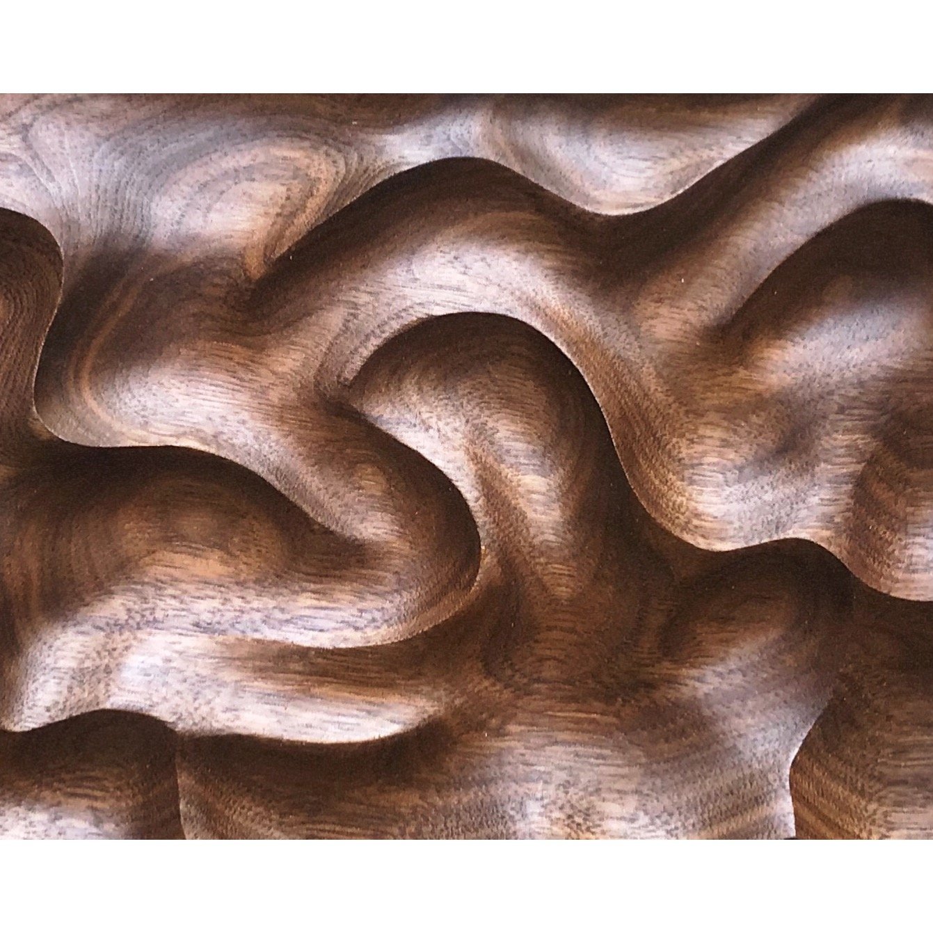 Image of Pinches and swirls. Walnut wall hanging. 