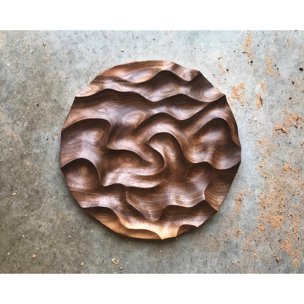 Image of Pinches and swirls. Walnut wall hanging. 