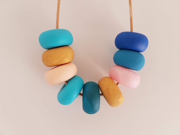 Image of Blue, pink and gold clay bead necklace