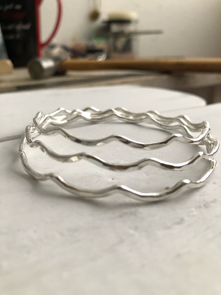 Image of Sterling silver wavy bangle.