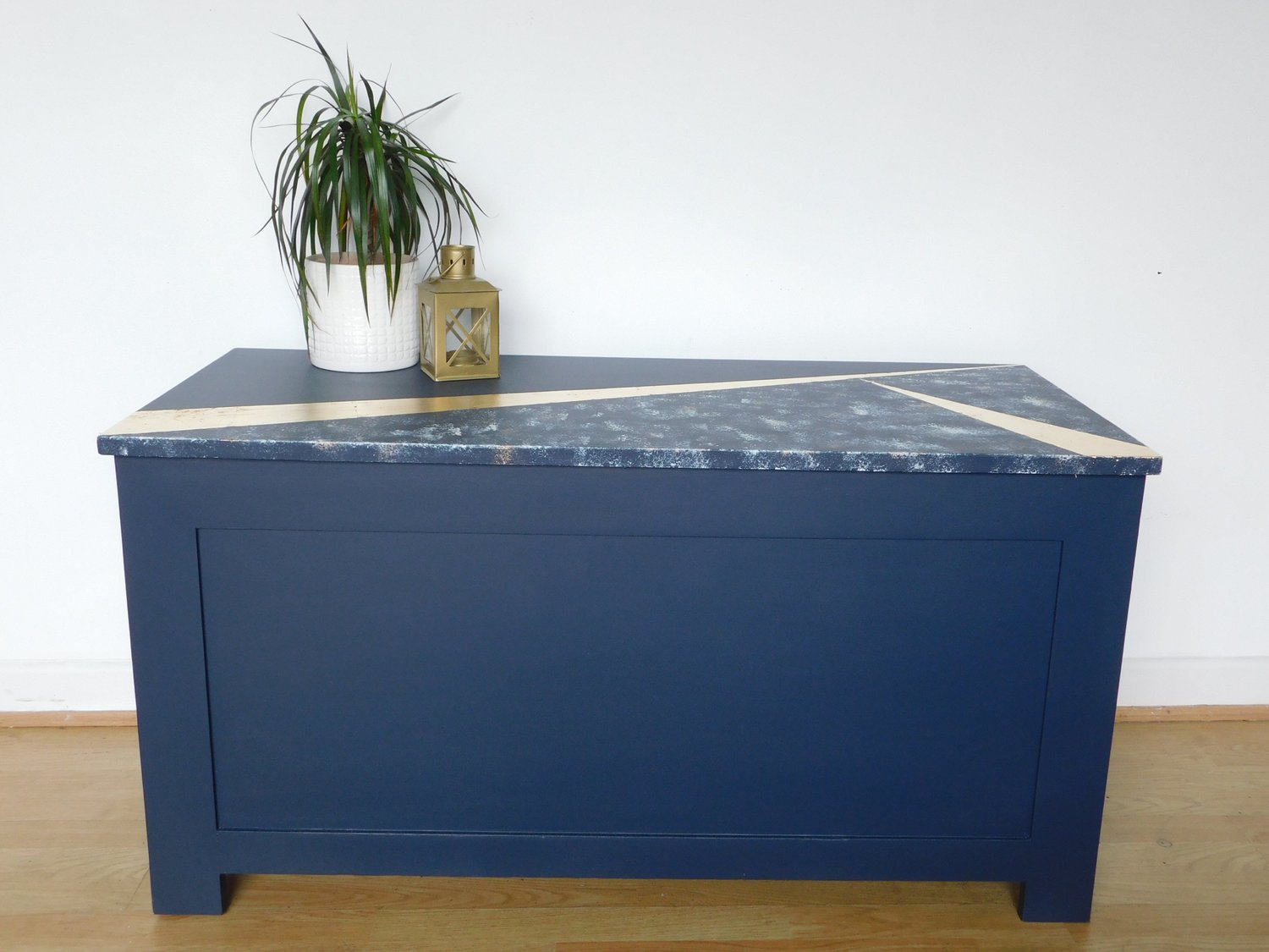 Image of A dark blue & gold design storage box