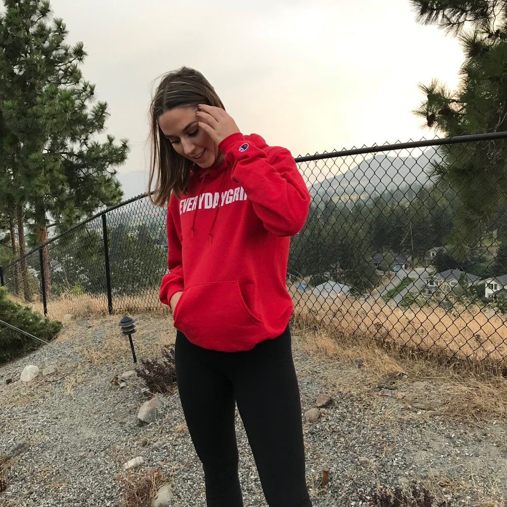 Image of red/white “everydaygrind” (champion) hoodie