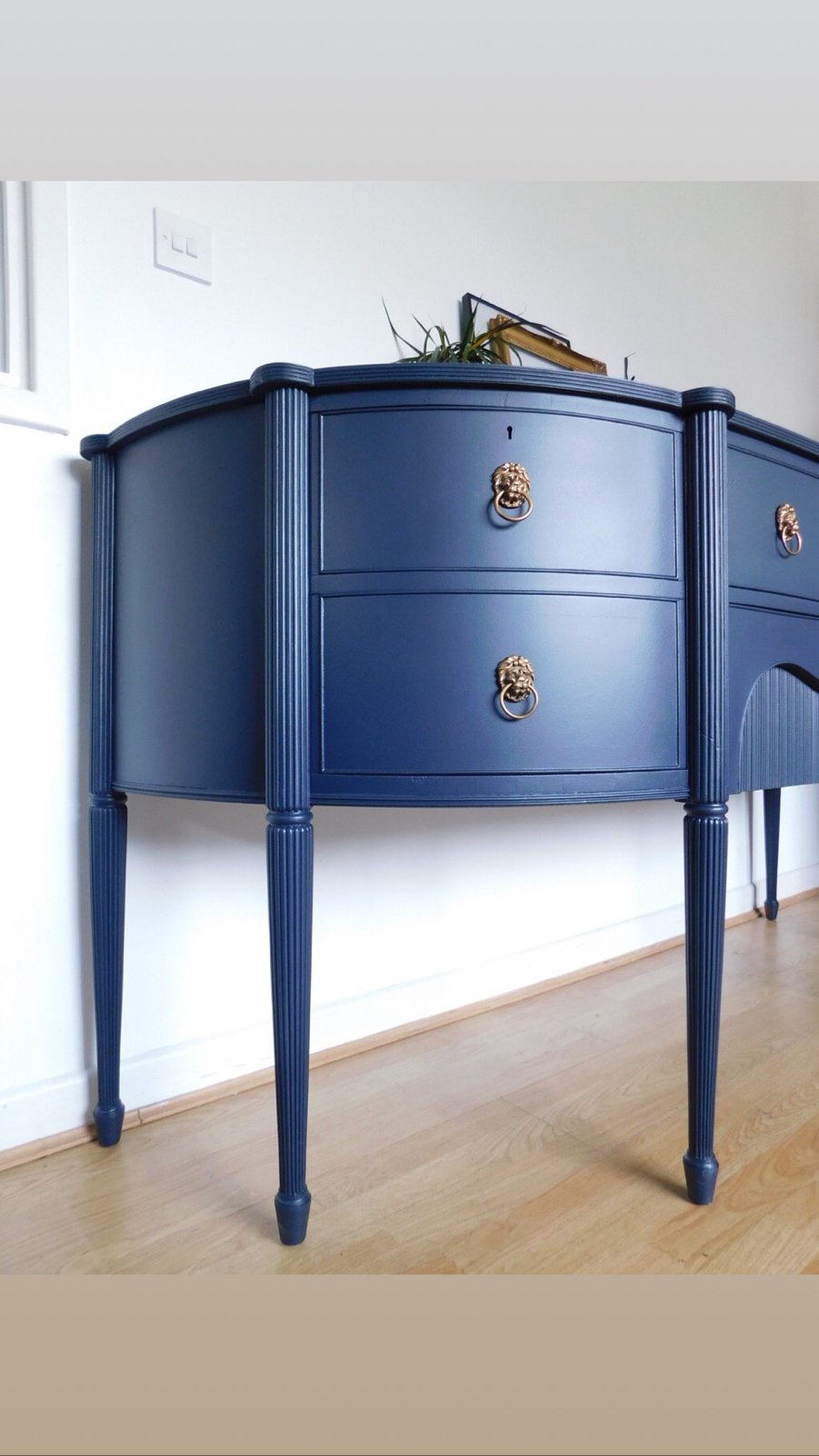 Image of A solid mahogany dark blue sideboard