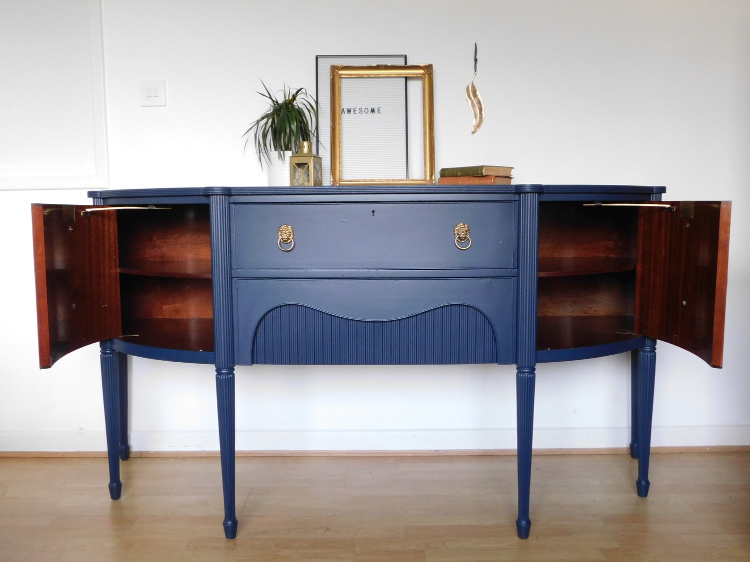 Image of A solid mahogany dark blue sideboard