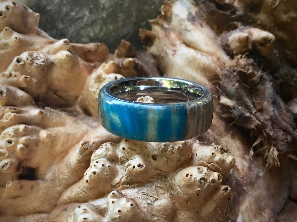 Image of Monkey Pod wood with blue swirled resin