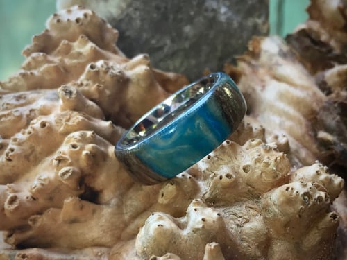 Image of Monkey Pod wood with blue swirled resin