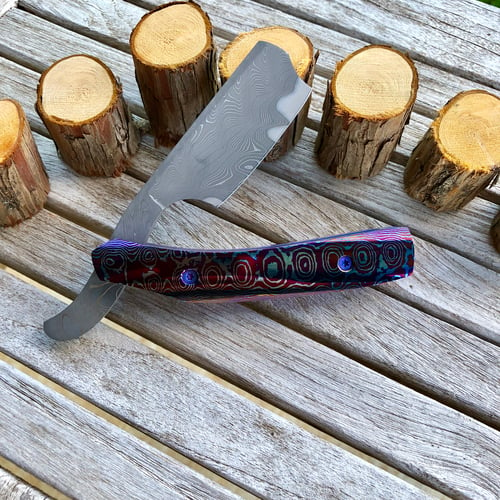 Image of (Pre-Owned) CMF Metalworks Straight Razor with Mokuti Handles and Armor Core Damascus blade.