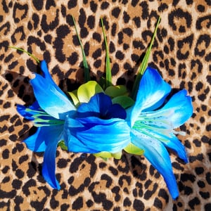 Image of Large Blue Lillies With Green Lillies Hair Flower