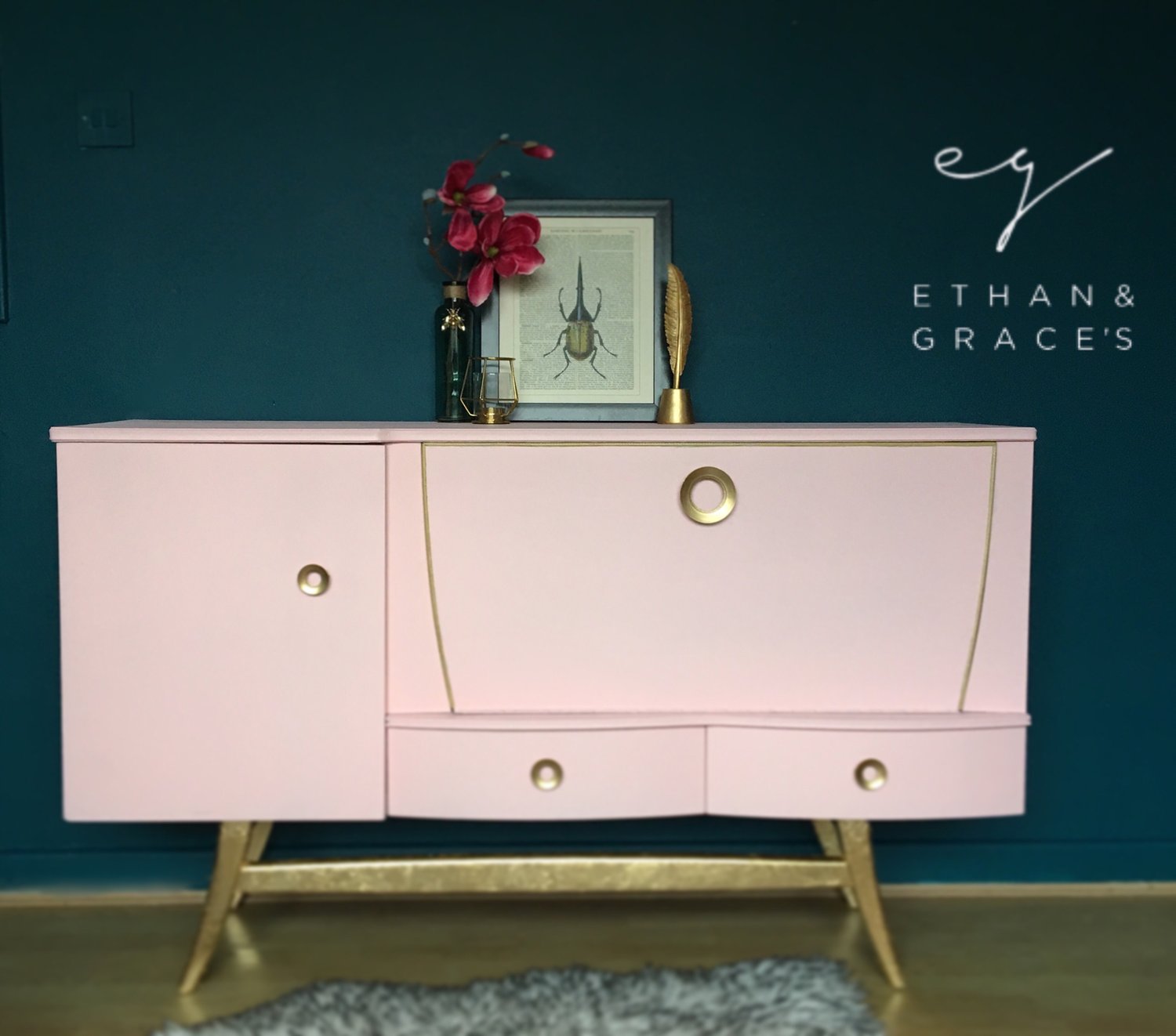 Image of A mid century modern drinks sideboard in pink & gold