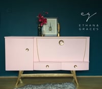 Image 1 of A mid century modern drinks sideboard in pink & gold