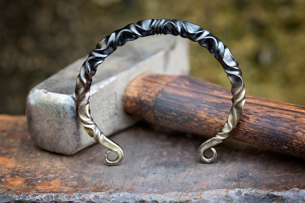 Image of bronzed Viking arm ring | reverse twist mild steel + bronze