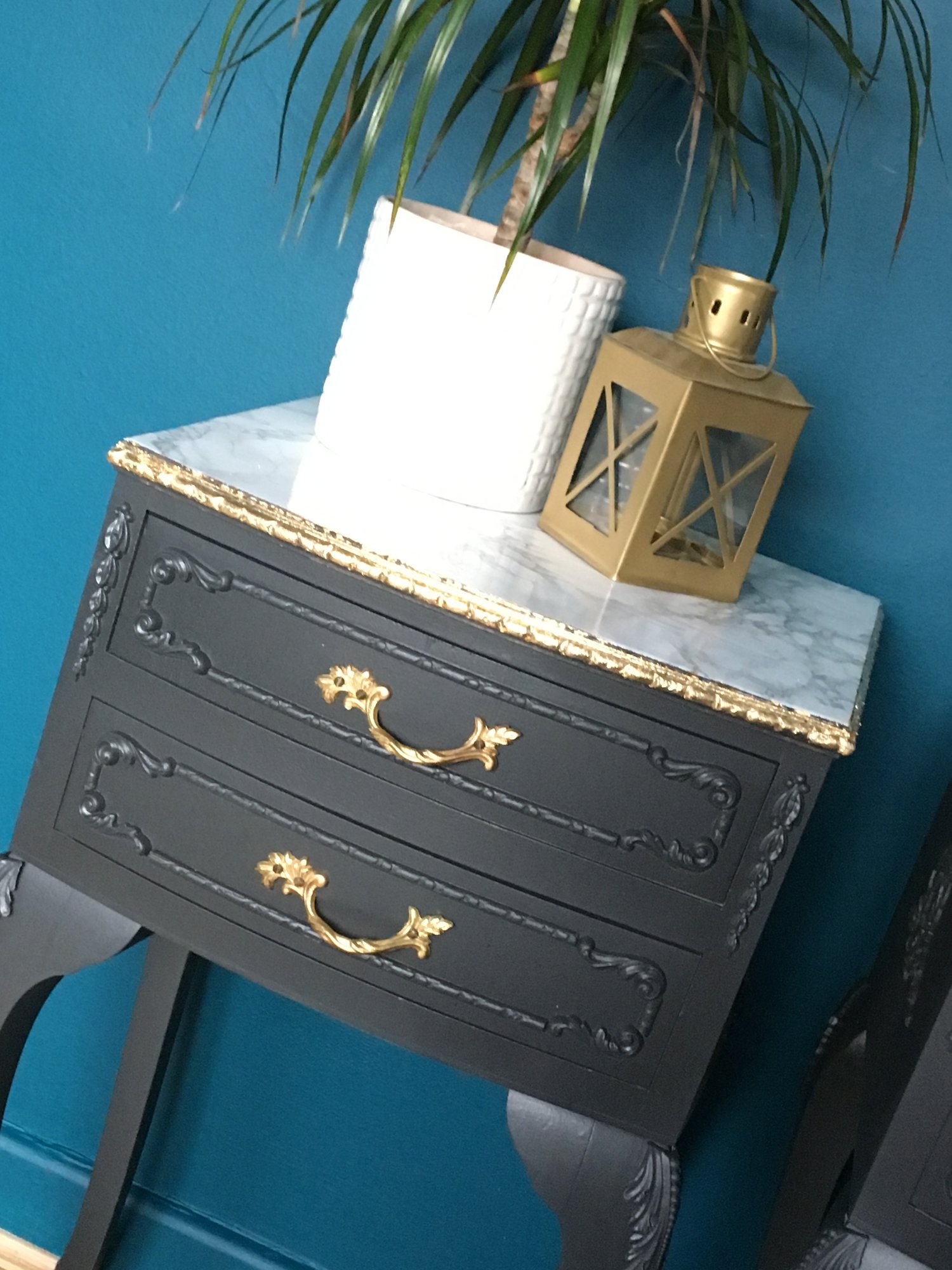 Image of A pair of dark grey, gold leaf & marble bedside tables 