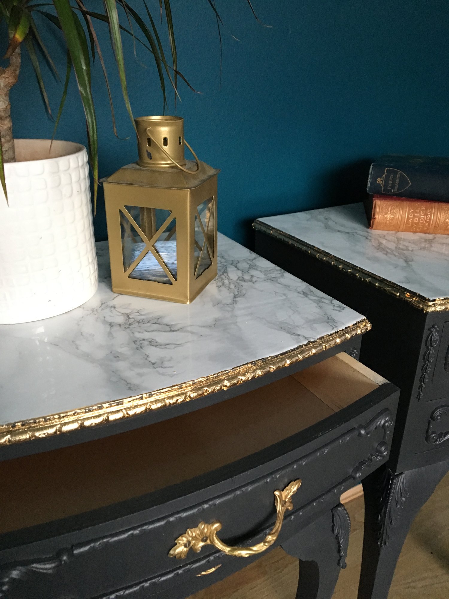 Image of A pair of dark grey, gold leaf & marble bedside tables 