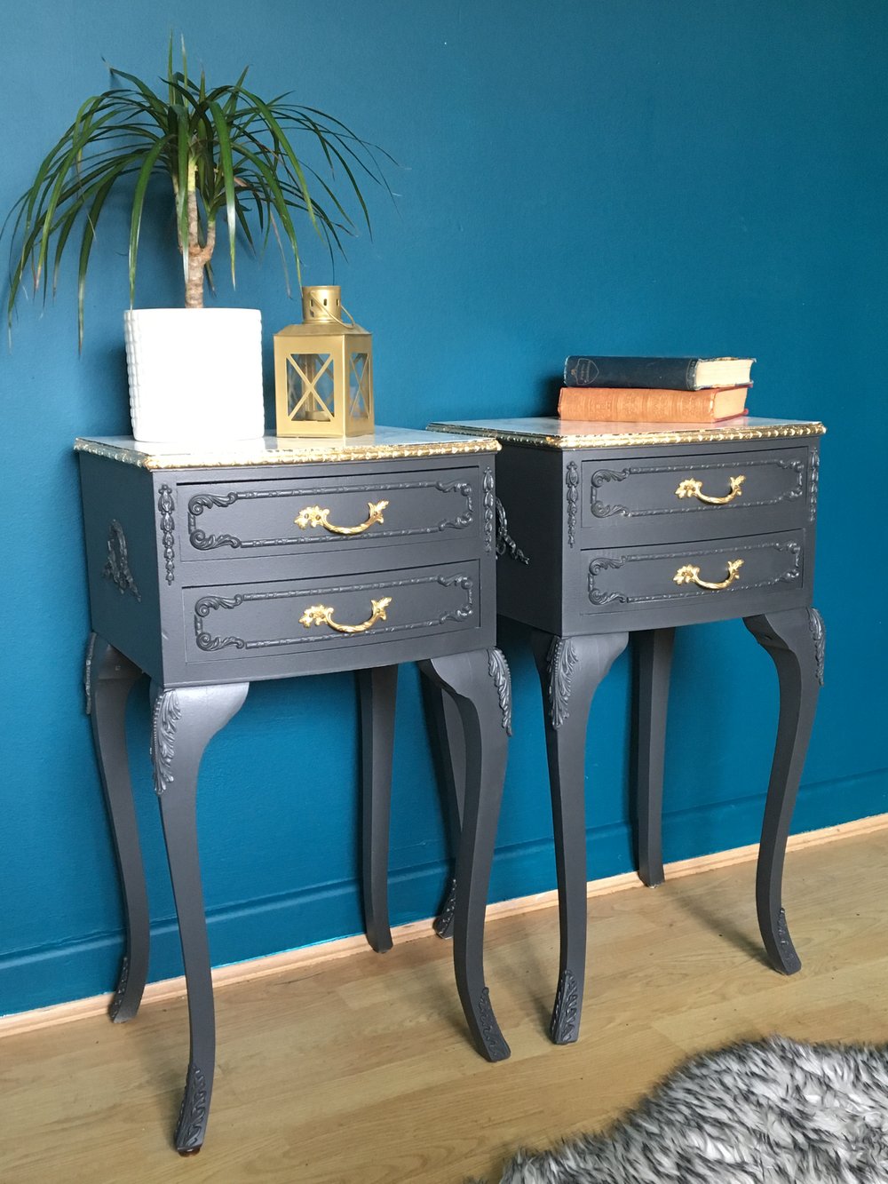 Image of A pair of dark grey, gold leaf & marble bedside tables 