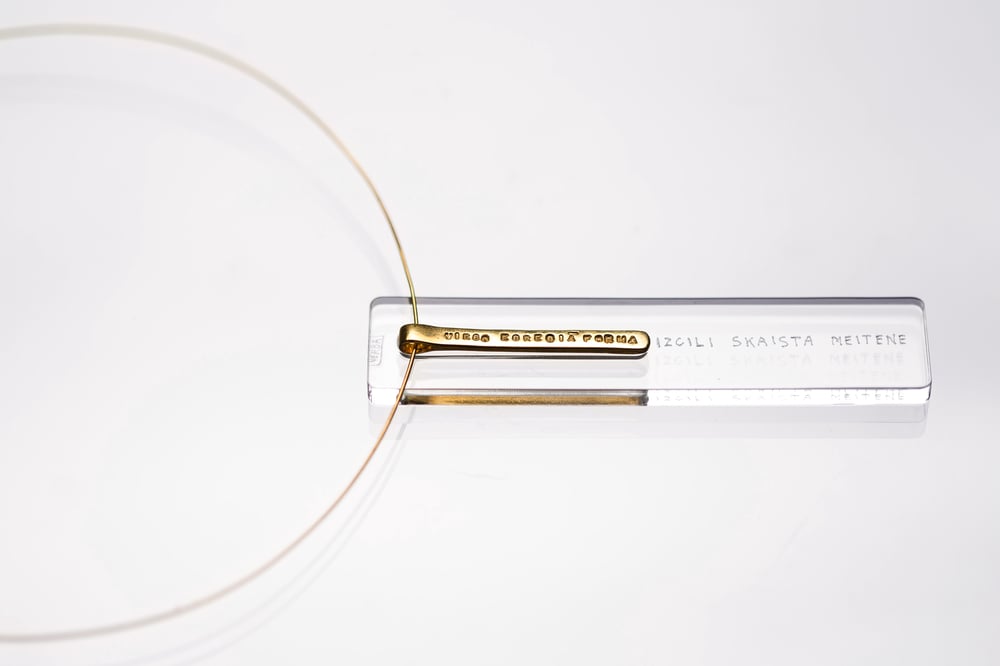 Image of gold plated silver long pendant with inscription in Latin