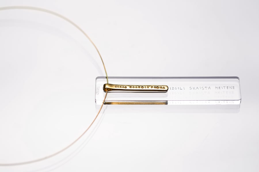 Image of gold plated silver long pendant with inscription in Latin