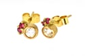 18ct gold studs set, each set with rose cut white diamond and two pink spinel. 