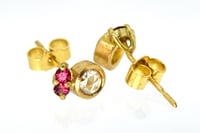 Image 1 of 18ct gold studs set, each set with rose cut white diamond and two pink spinel. 