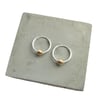 Silver hoops with single gold bead