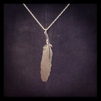 Hand cut mapgie feather silver necklace