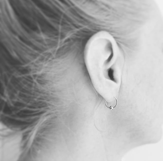 Silver hoops with single gold bead