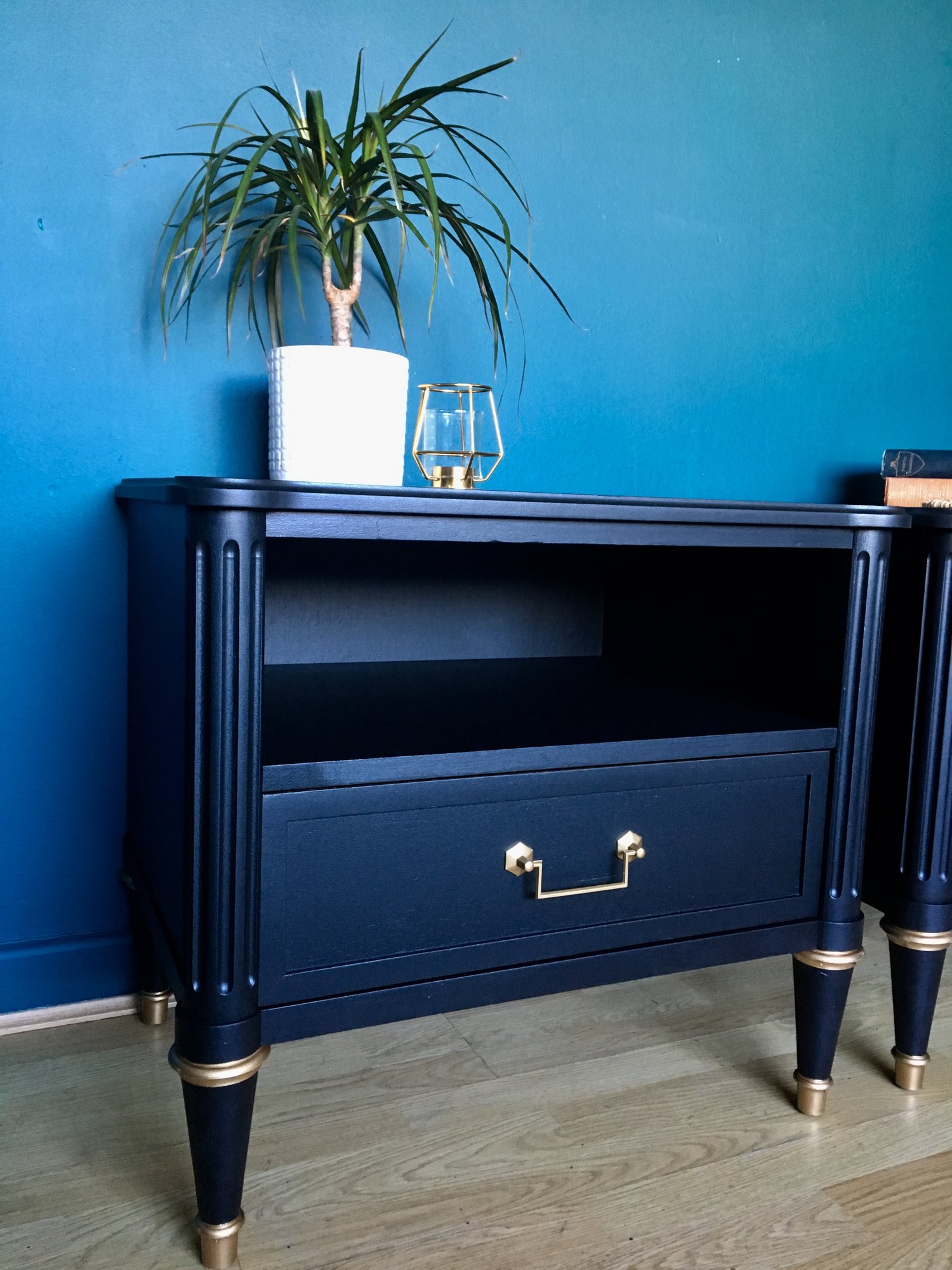 Image of A pair of black stag mahogany bedside tables 