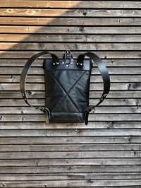 Image 3 of Black leather backpack with waxed canvas roll to close top