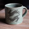 Hare and Rook Mug. Green Celadon glaze.