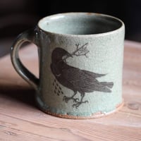 Image 2 of Hare and Rook Mug. Green Celadon glaze.