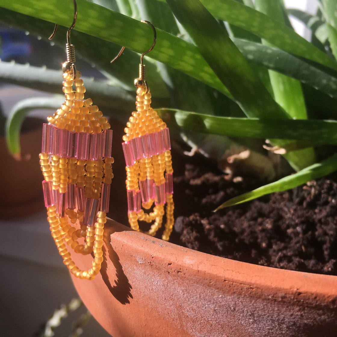 Image of translucent pink & yellow beaded earrings 
