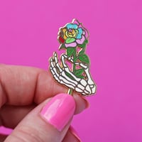 Image 1 of Skeleton hand holding a rainbow rose, enamel pin - bones - skeleton pin - anatomy - lapel pin badge