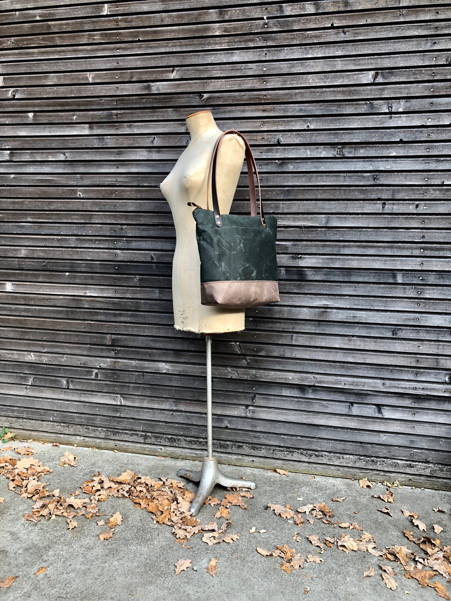 Image of Waxed canvas tote bag with leather handles and zipper closure