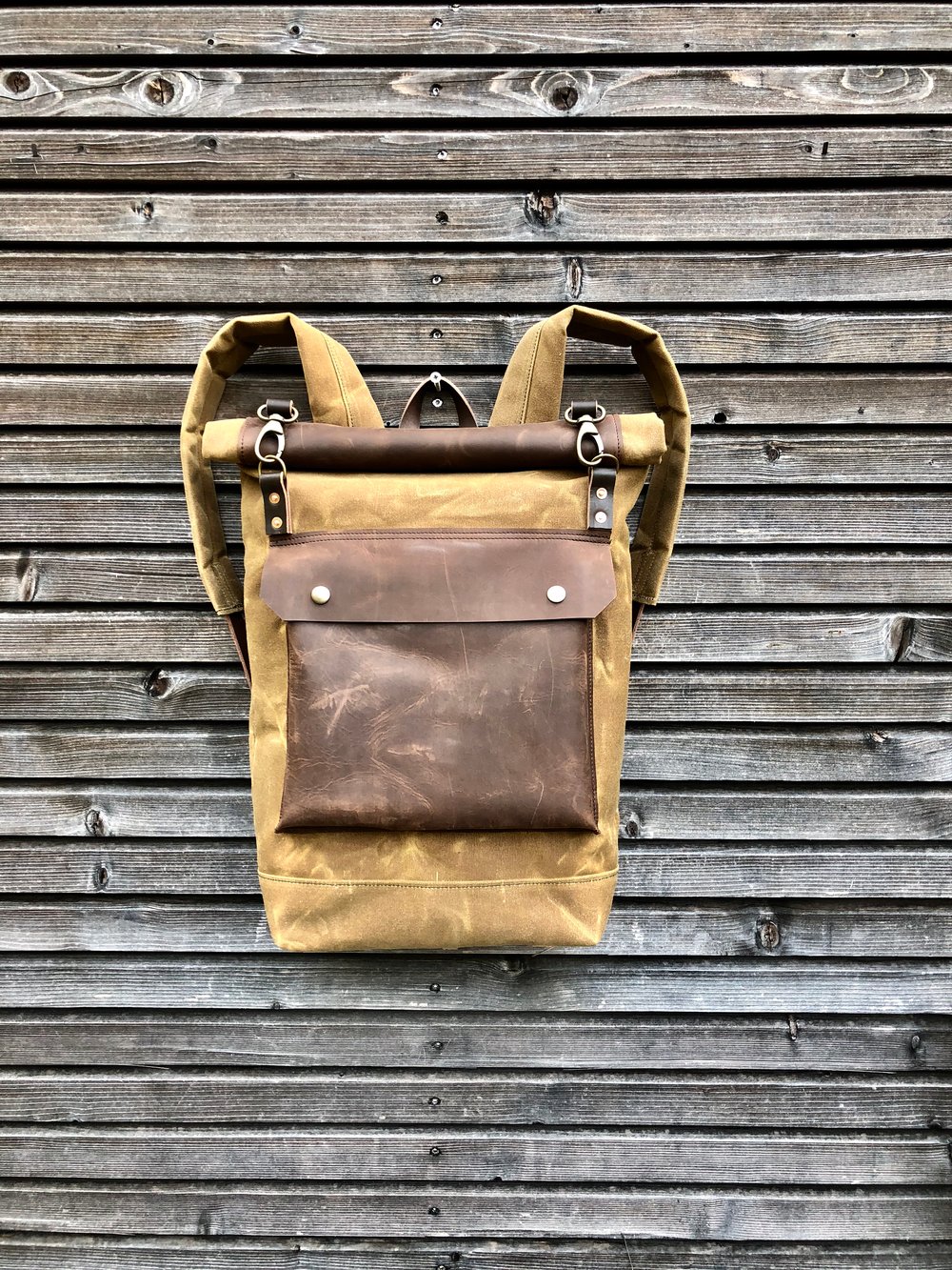 Image of Waxed canvas rucksack/backpack with roll up top and double waxed bottem COLLECTION UNISEX