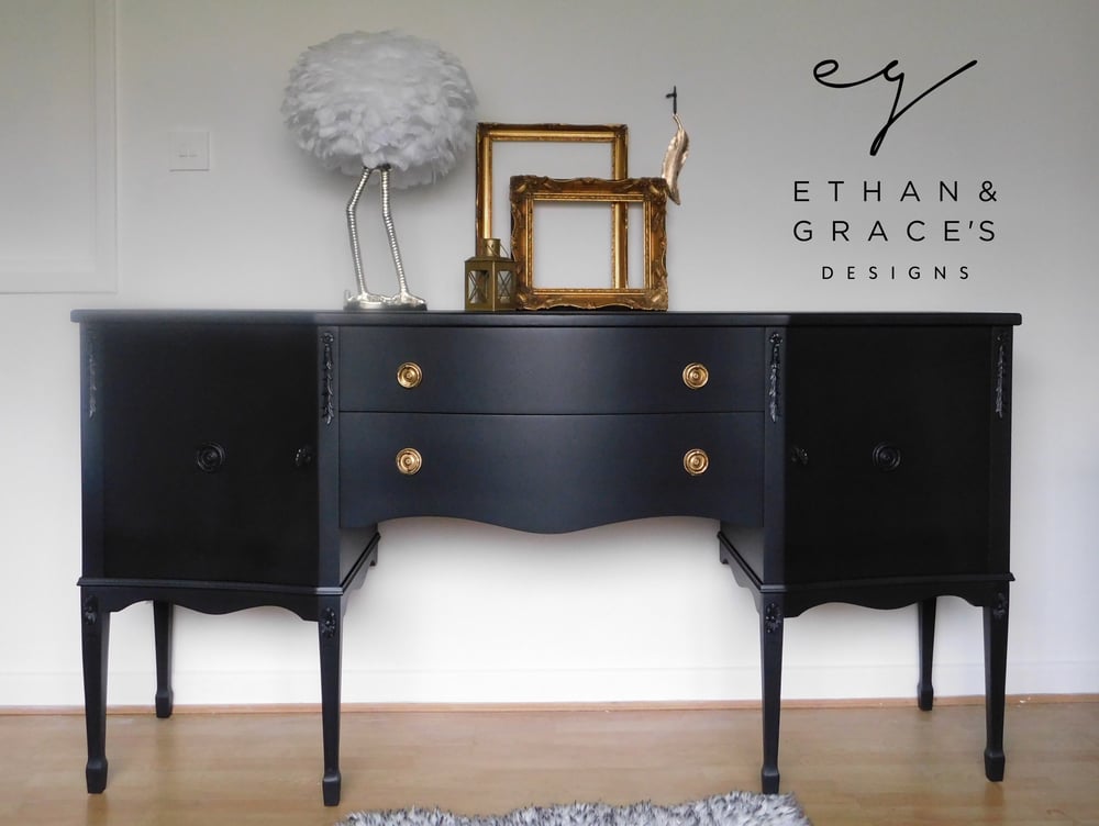 Image of A black sideboard with 2 working keys