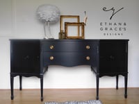 Image 1 of A black sideboard with 2 working keys
