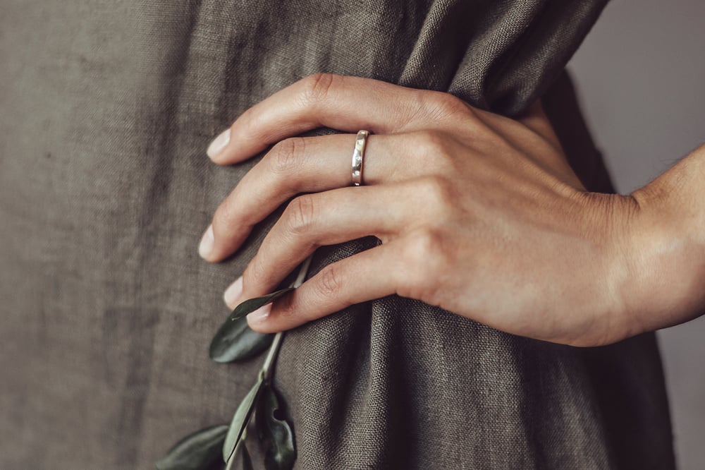Image of silver ring for children with inscription in Latin
