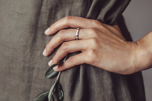 Image of silver ring for children with inscription in Latin