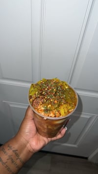 Image 3 of Esha’s Spicy Bowl  - Shrimp, beef sausage, boiled egg, jalapeño, banana peppers, onion and chips 